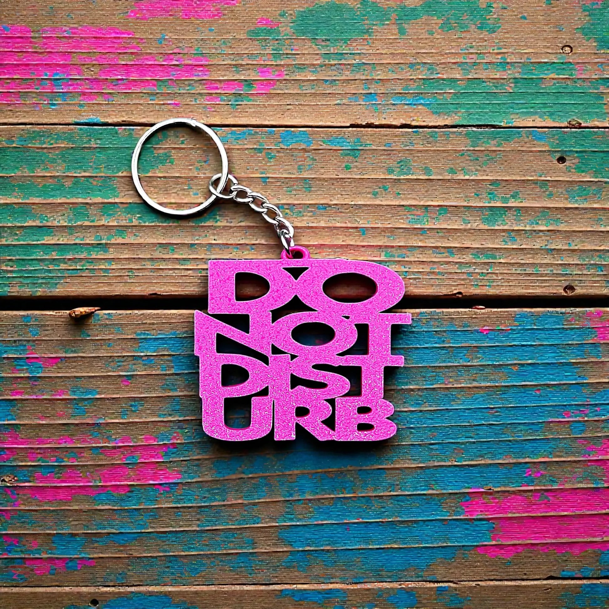 Handmade and customizable Do Not Disturb keychain in magenta, perfect gift for introverts or gamers.