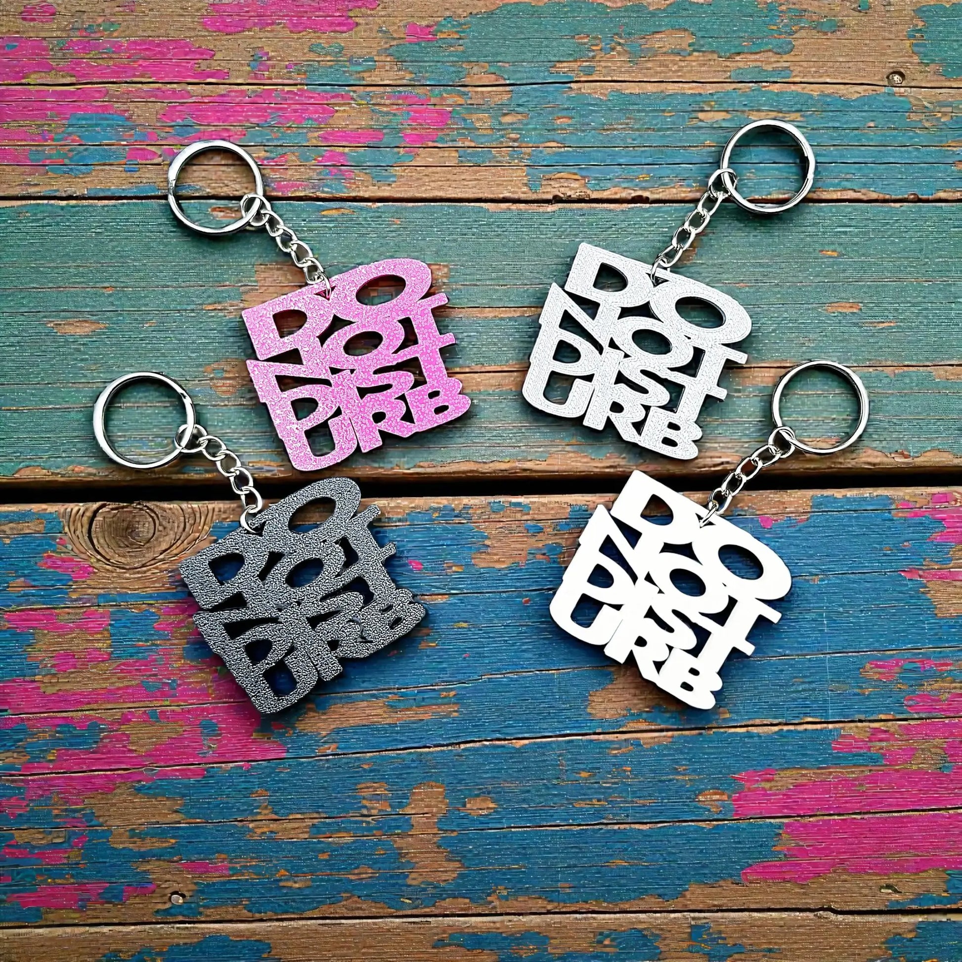 Handmade and customizable Do Not Disturb keychains in assorted colors, perfect gift for introverts or gamers.