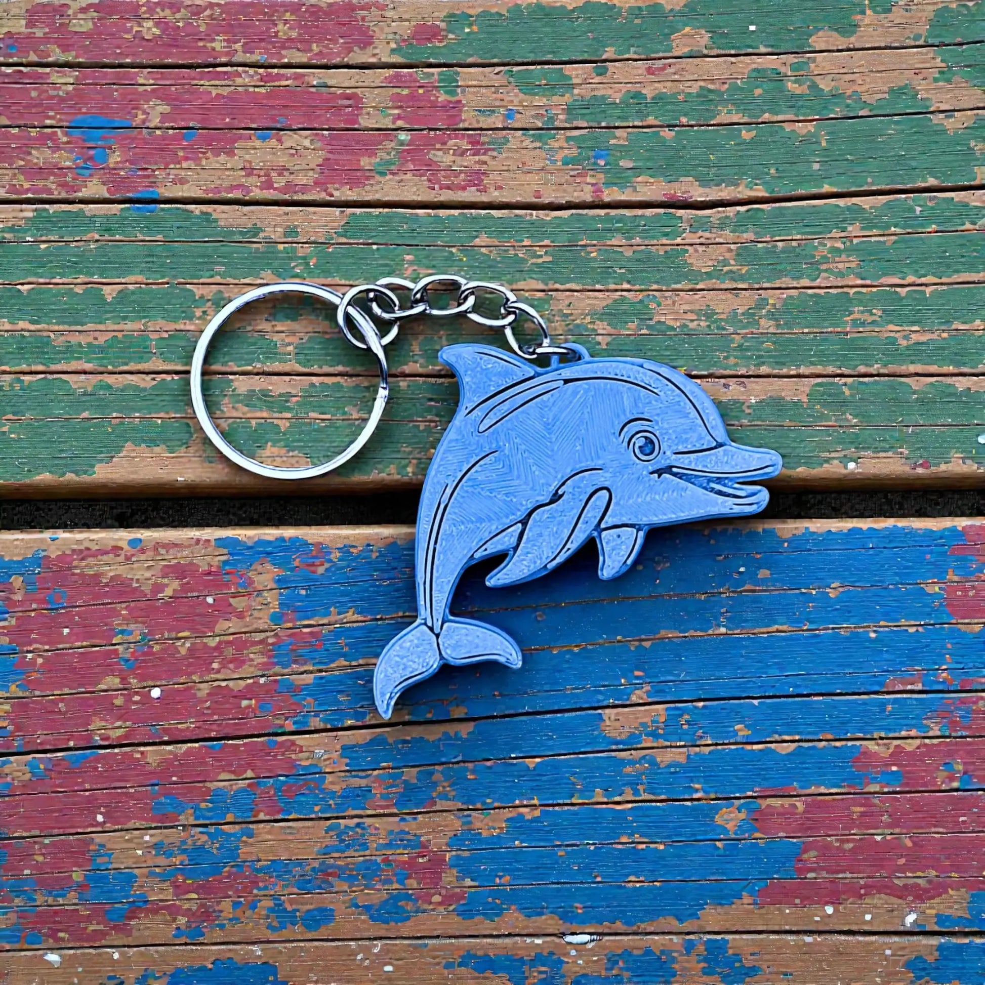 Handmade and customizable dolphin keychain in blue gray, perfect for classroom prizes, party favors for kids birthdays, and unique bag charms.