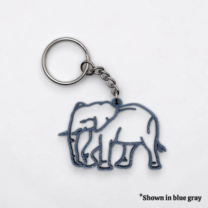 Keychain with elephant design in blue gray on a white background