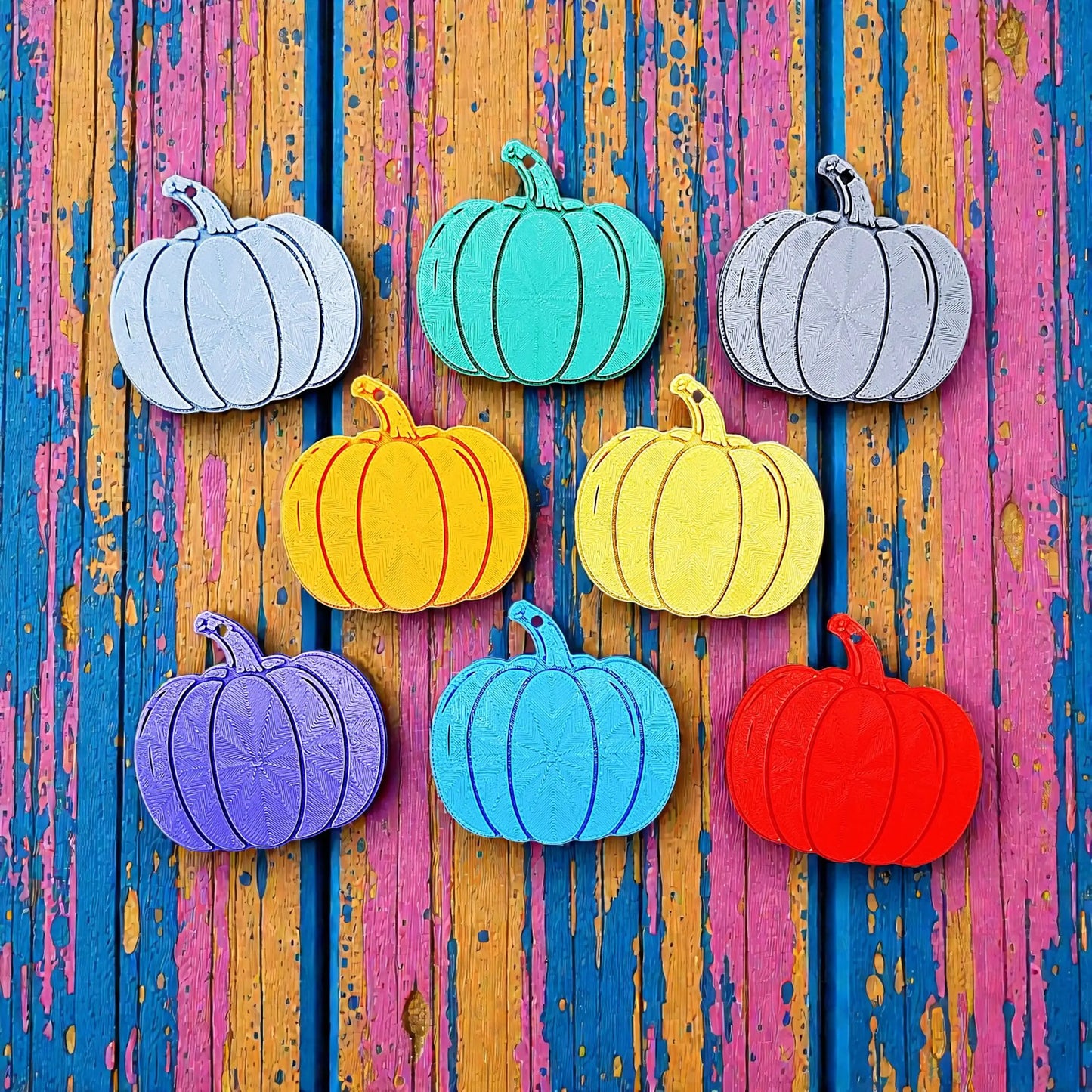 Handmade and customizable pumpkin keychains in various colors, ideal for fall themed party favors, cute bag charms, and classroom prizes.
