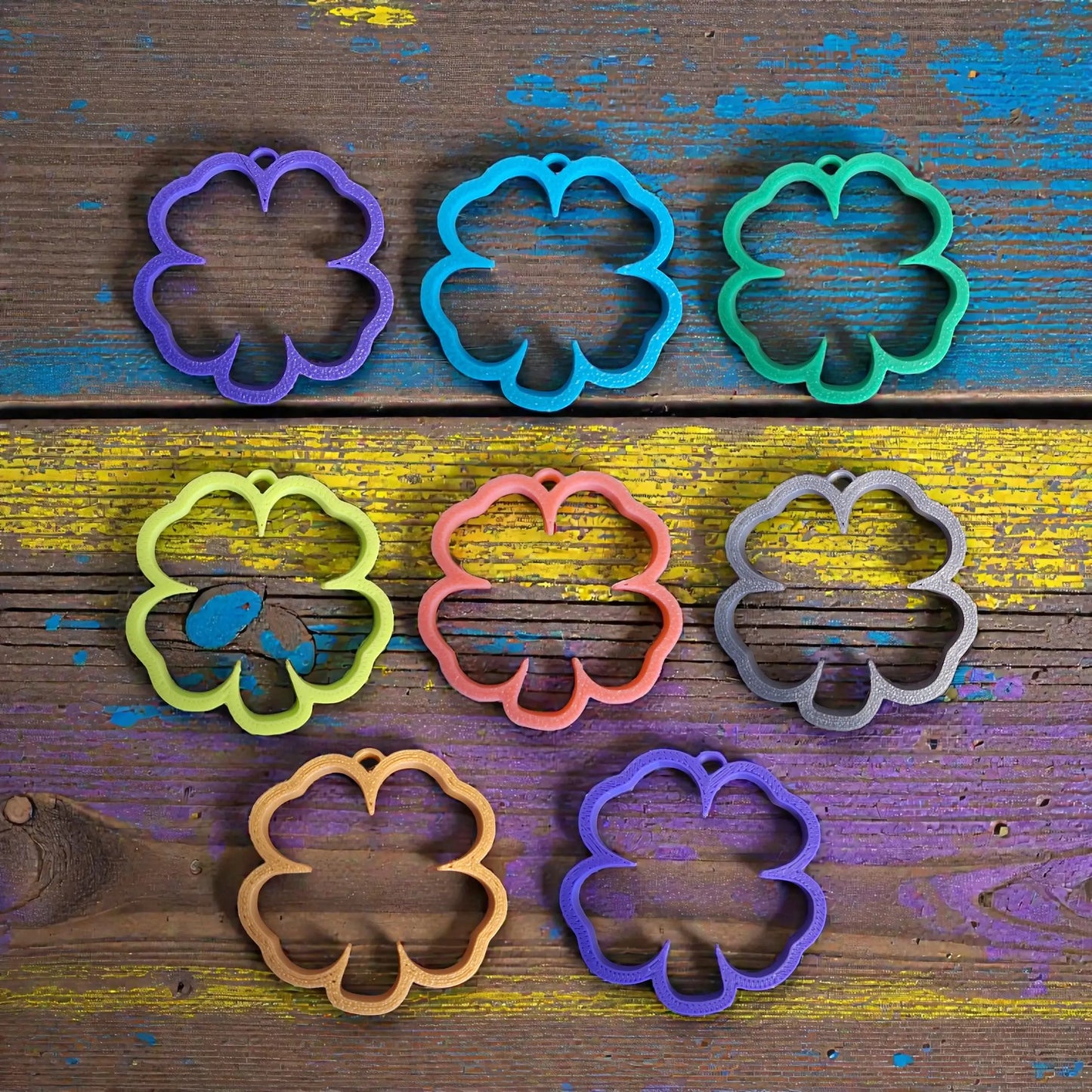 Customizable four leaf clover keychains in assorted colors, perfect for Irish themed gifts and St Patrick's Day party favors.