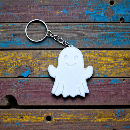 Handmade and customizable ghost keychain in white, perfect for Halloween party favors, trick or treats, and fun Fall gifting for kids.