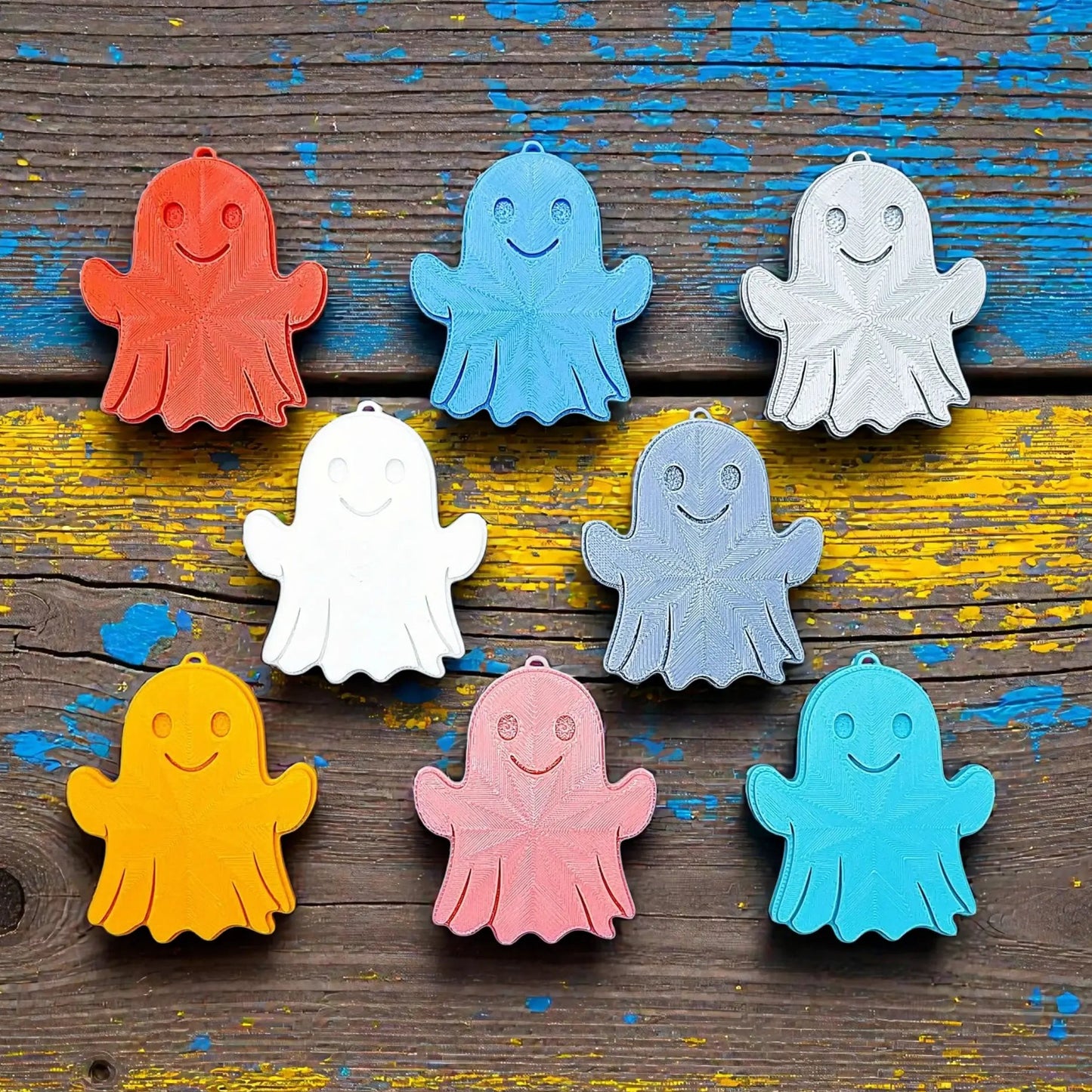 Handmade and customizable ghost keychains in various colors, perfect for Halloween party favors, trick or treats, and fun Fall gifting for kids.