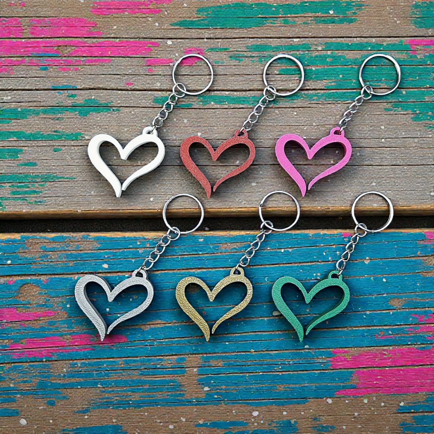 Handmade and customizable heart keychains in assorted colors, perfect for Valentine's Day, party favors, baby showers, or everyday gifts.
