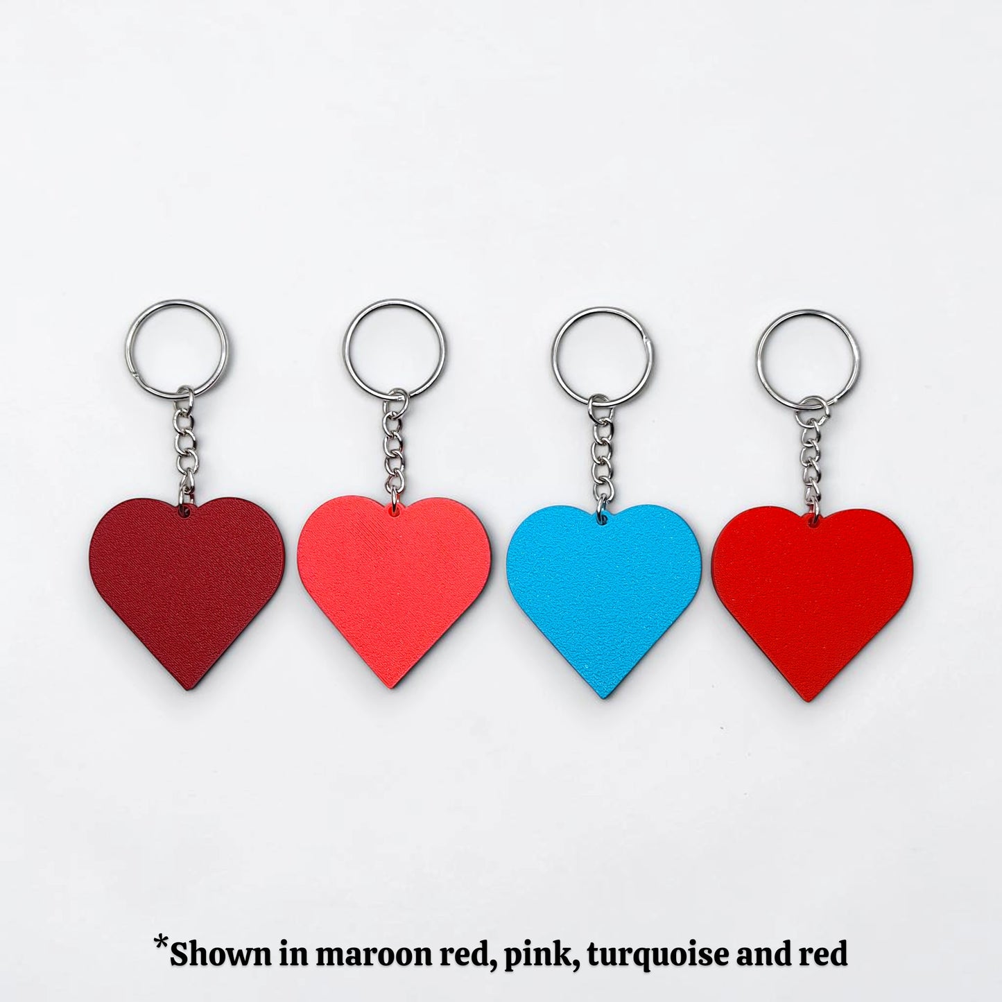 Handmade and customizable heart keychains in different colors, perfect for classroom prizes, Valentine's Day gifts, party favors for kids birthdays, baby showers and unique backpack charms.