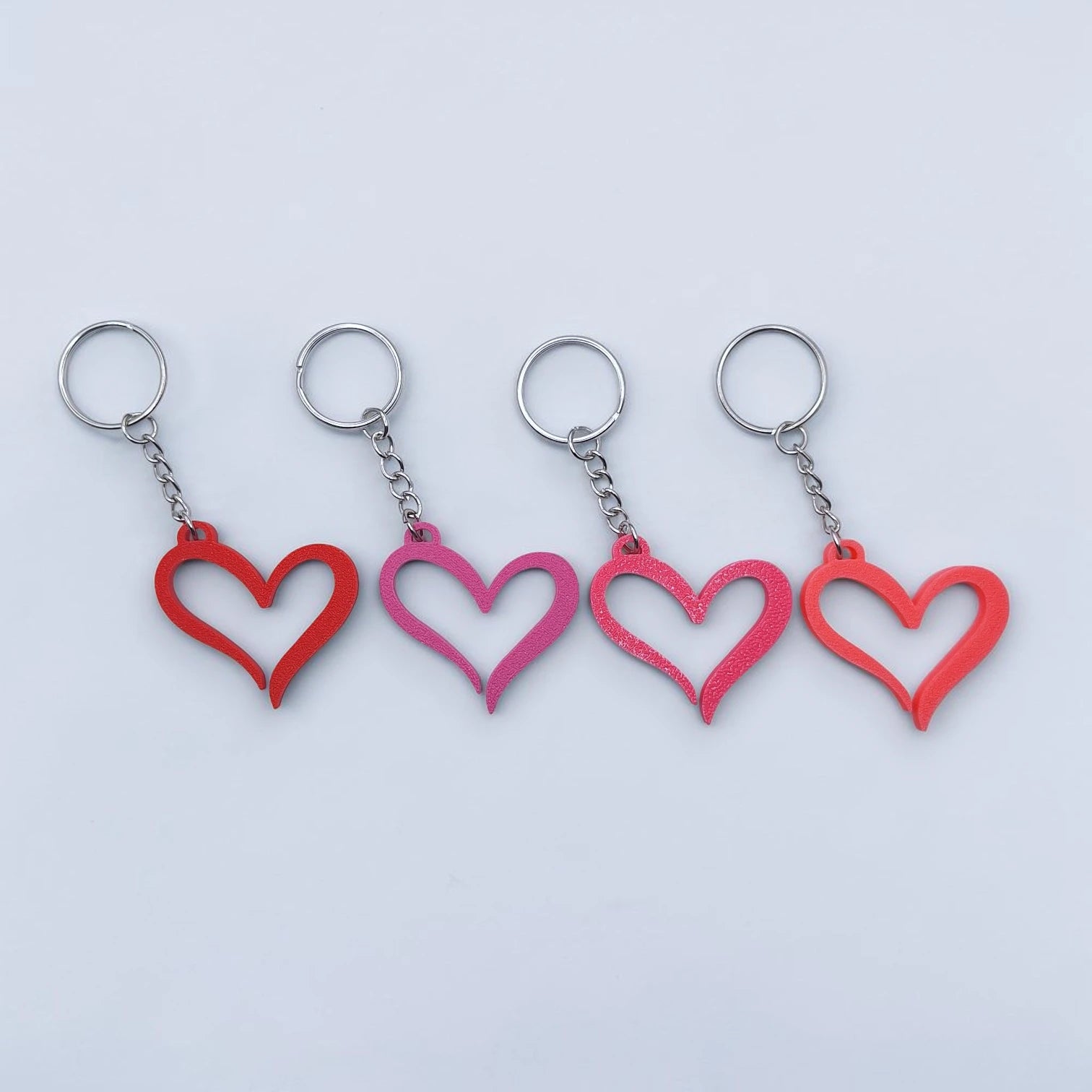 Handmade and customizable heart keychains in assorted colors, perfect for Valentine's Day, party favors, baby showers, or everyday gifts.