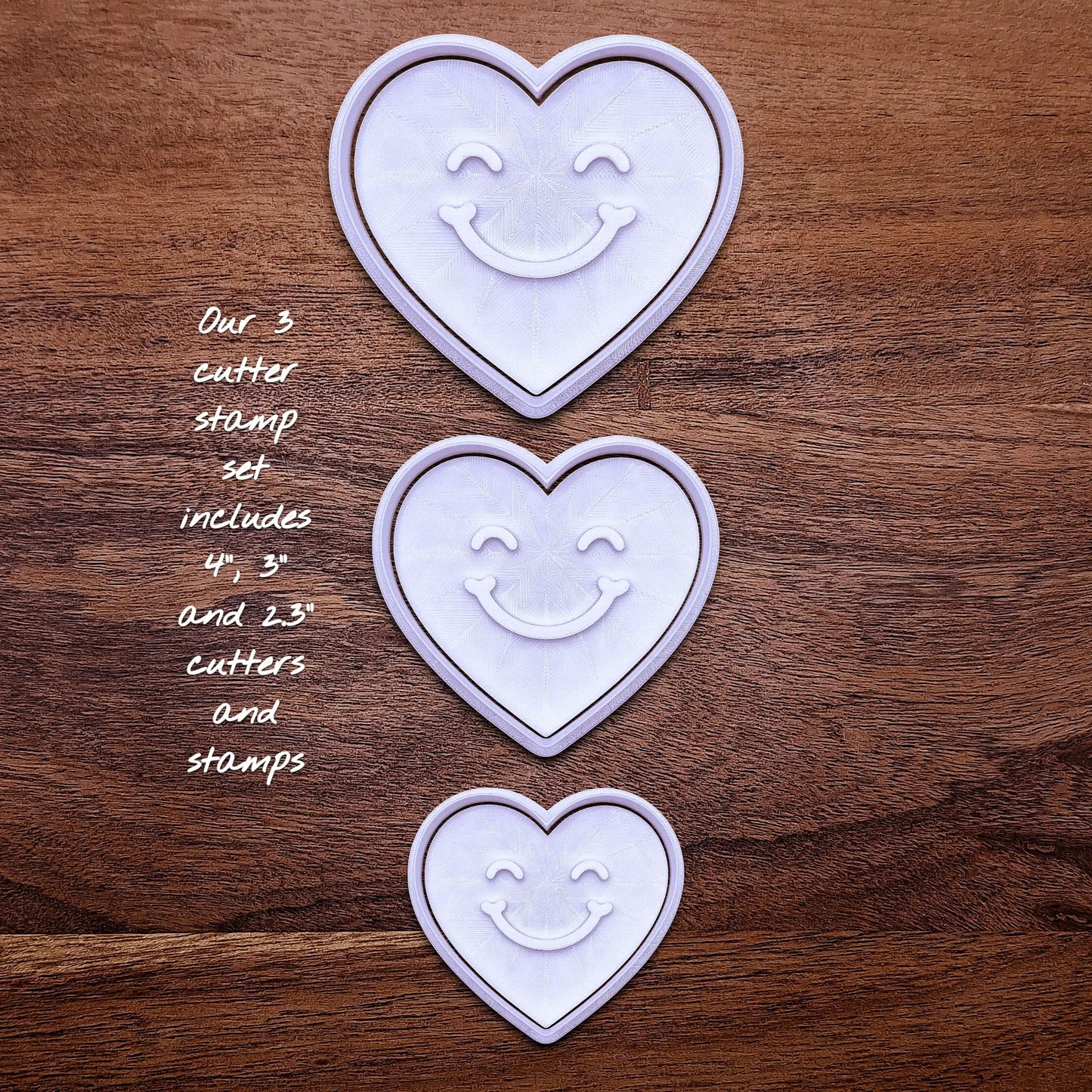 Handmade and customizable heart cookie cutter set with cute face stamp, perfect for Valentine's Day baking, sweet treats and party favor creations.