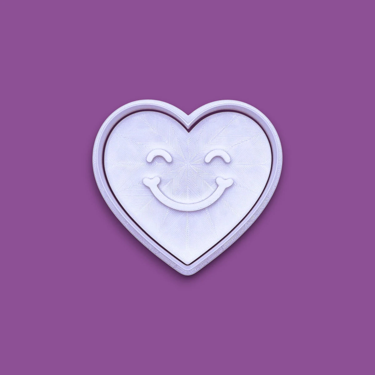Handmade and customizable heart cookie cutter with cute face stamp, perfect for Valentine's Day baking, sweet treats and party favor creations.