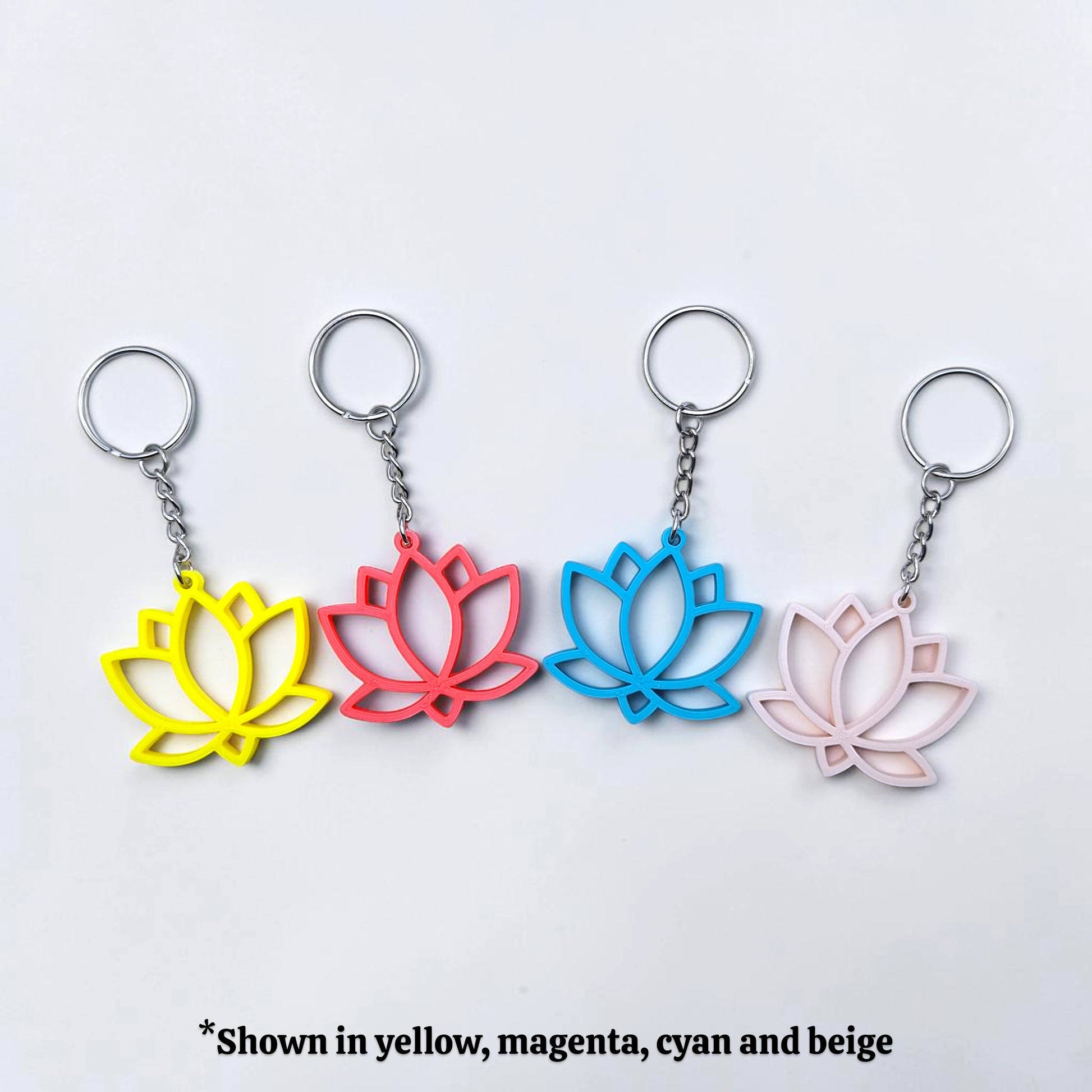 Lotus flower keychains shown in various vibrant colors, eco-friendly and handmade, perfect for spiritual gifts or mindful accessories.