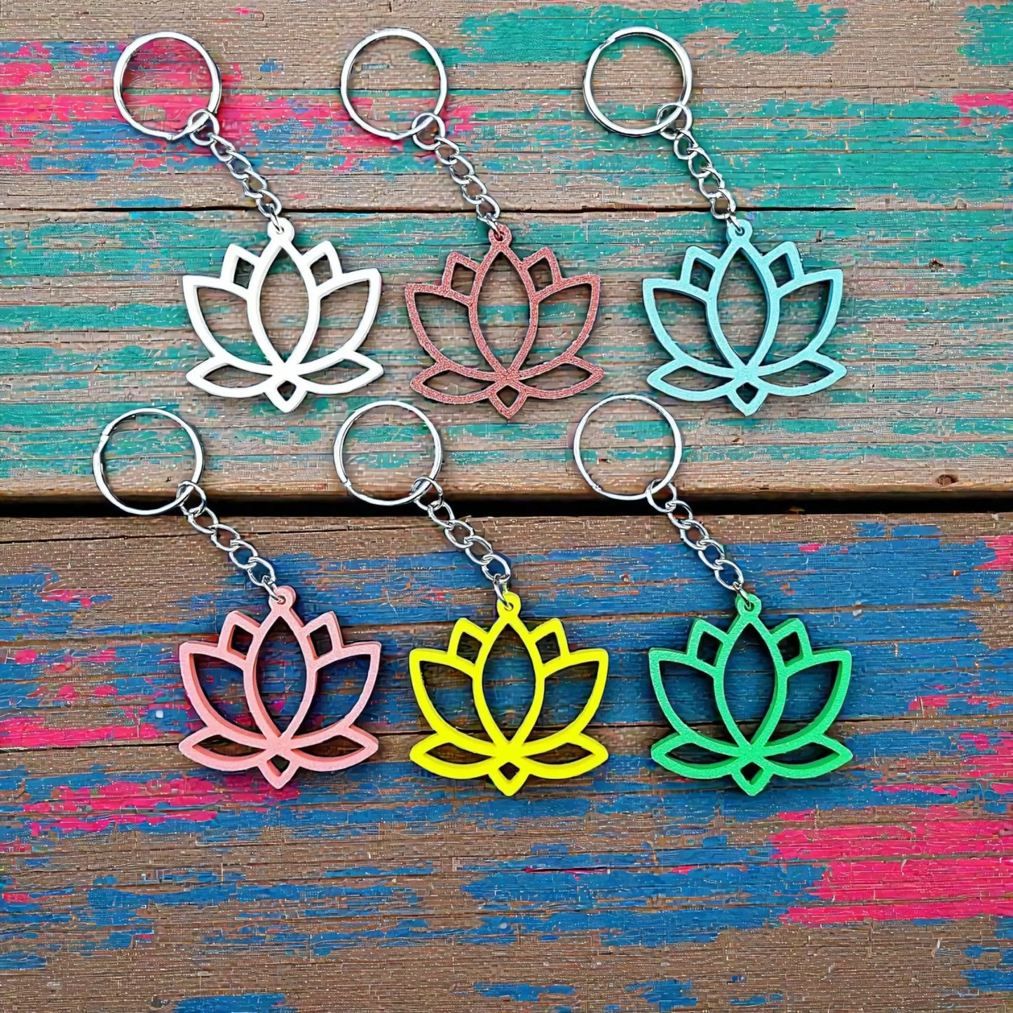 Lotus flower keychains shown in multiple colors, eco-friendly and handmade, perfect for spiritual gifts or mindful accessories.