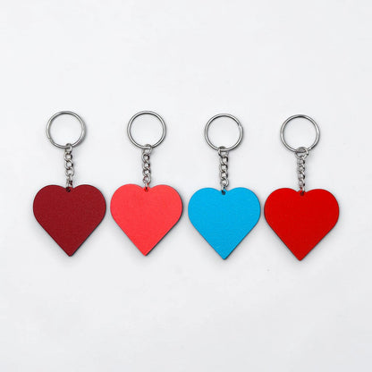 Handmade and customizable heart keychains in assorted colors, perfect for classroom prizes, Valentine's Day gifts, party favors for kids birthdays, baby showers and unique backpack charms.