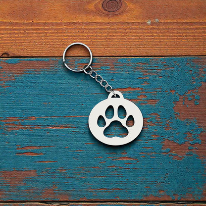 Handmade and customizable paw print keychain in white, perfect for pet lovers, events and animal themed gifts.