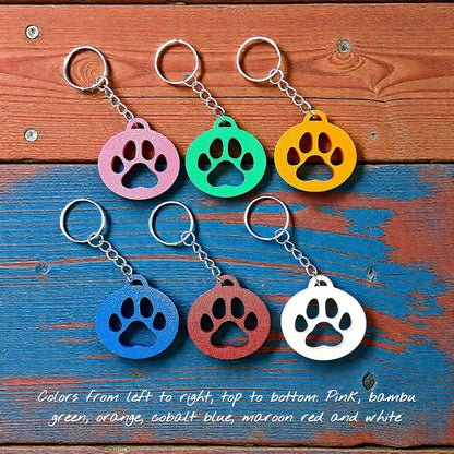 Handmade and customizable paw print keychains in six colors, perfect for pet lovers, events and animal themed gifts.