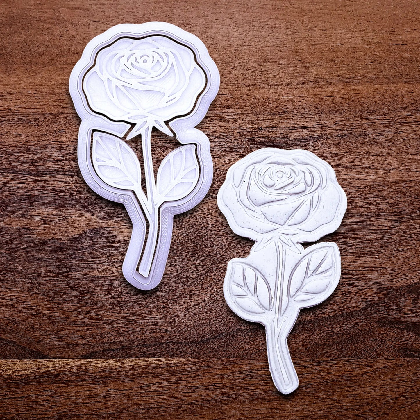 Handmade and customizable Rose Cookie Cutter and Stamp alongside a dough cutout and imprint, perfect for spring events, romantic weddings, or special occasions.