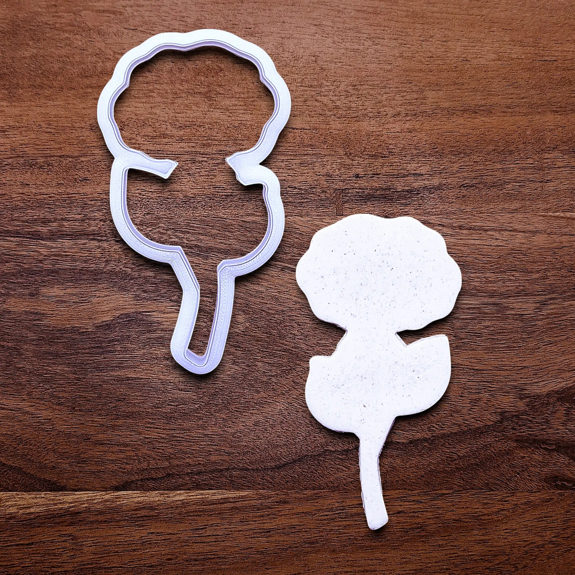 Handmade and customizable Rose Cookie Cutter alongside a dough cutout, perfect for spring events, romantic weddings, or special occasions.