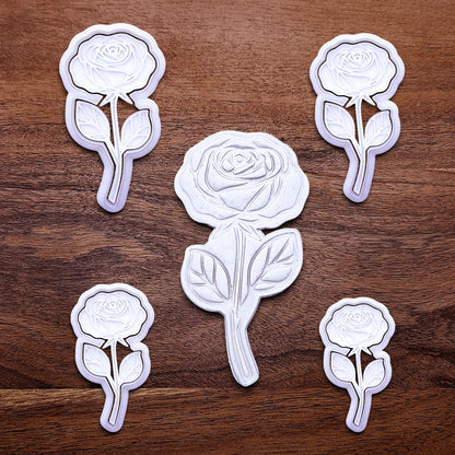 Handmade and customizable Rose Cookie Cutters and Stamps in multiple sizes alongside a dough cutout and imprint, perfect for spring events, romantic weddings, or special occasions.