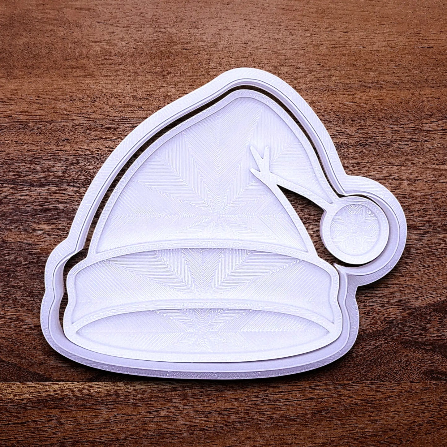 Santa hat cookie cutter and stamp, perfect for Christmas cookies, festive fondant toppers, or Xmas holiday crafts.