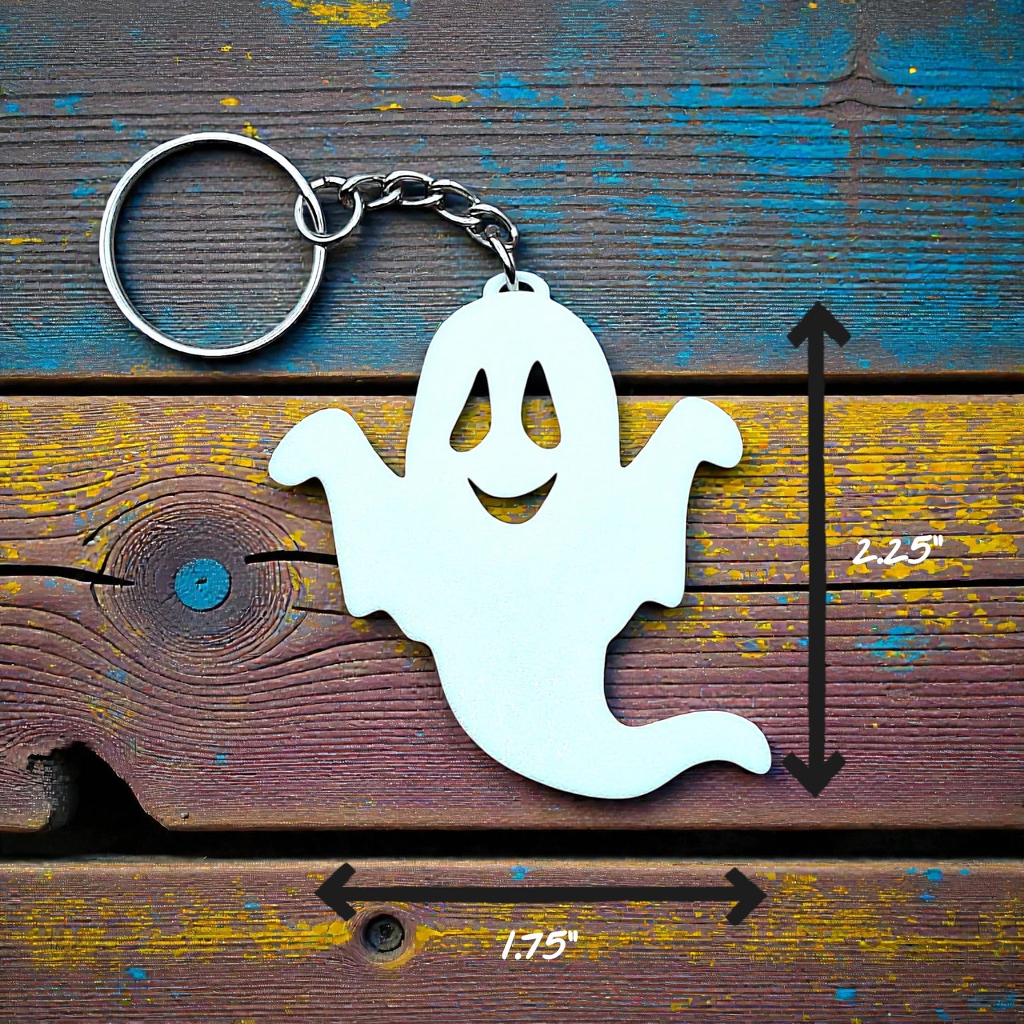 Handmade spooky Halloween ghost keychain in white, ideal for fall party favors, gifting, or accessorizing Halloween-themed trick or treat bags or keys.
