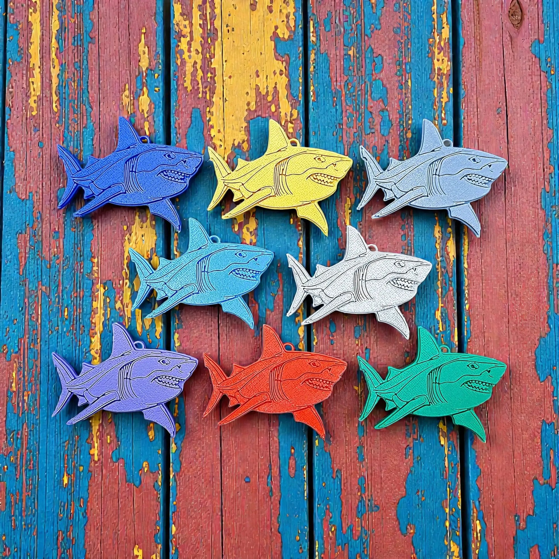 Handmade and customizable shark keychains in various colors, perfect for under-the-sea party favors, bag charms, and cool classroom prizes.