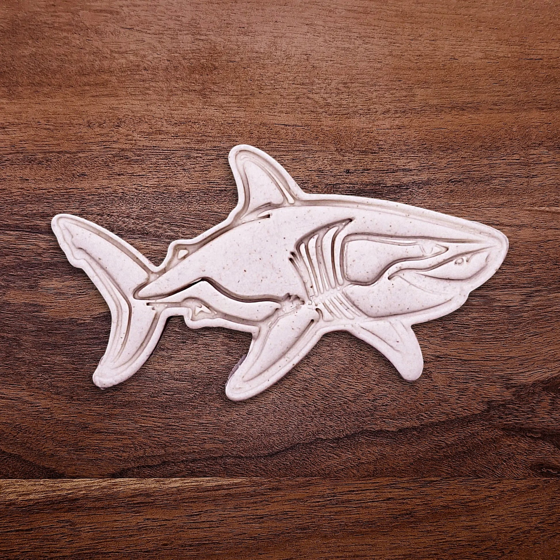 Handmade and customizable shark cookie cutter dough cutout and imprint, great for beach themed baking, fondant crafts, or ocean-themed cookies.