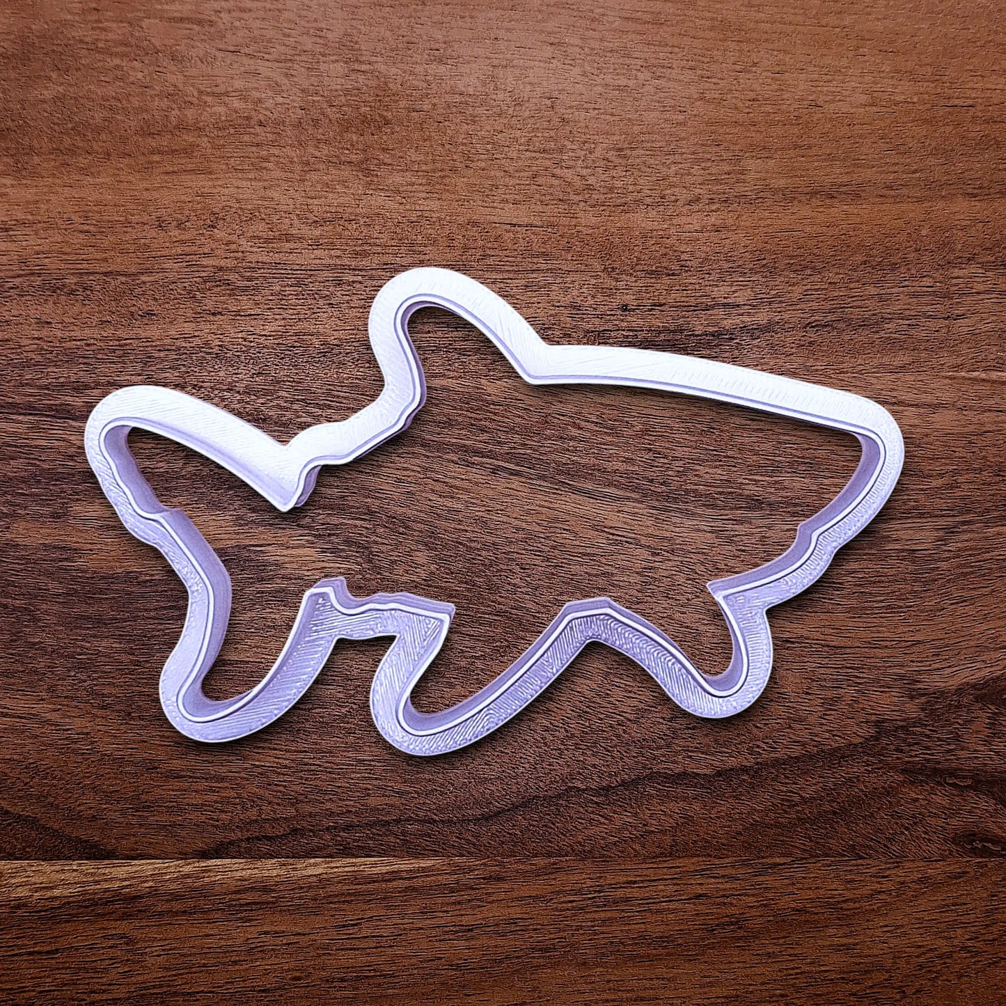 Handmade and customizable shark cookie cutter, great for beach themed baking, fondant crafts, or ocean-themed cookies.