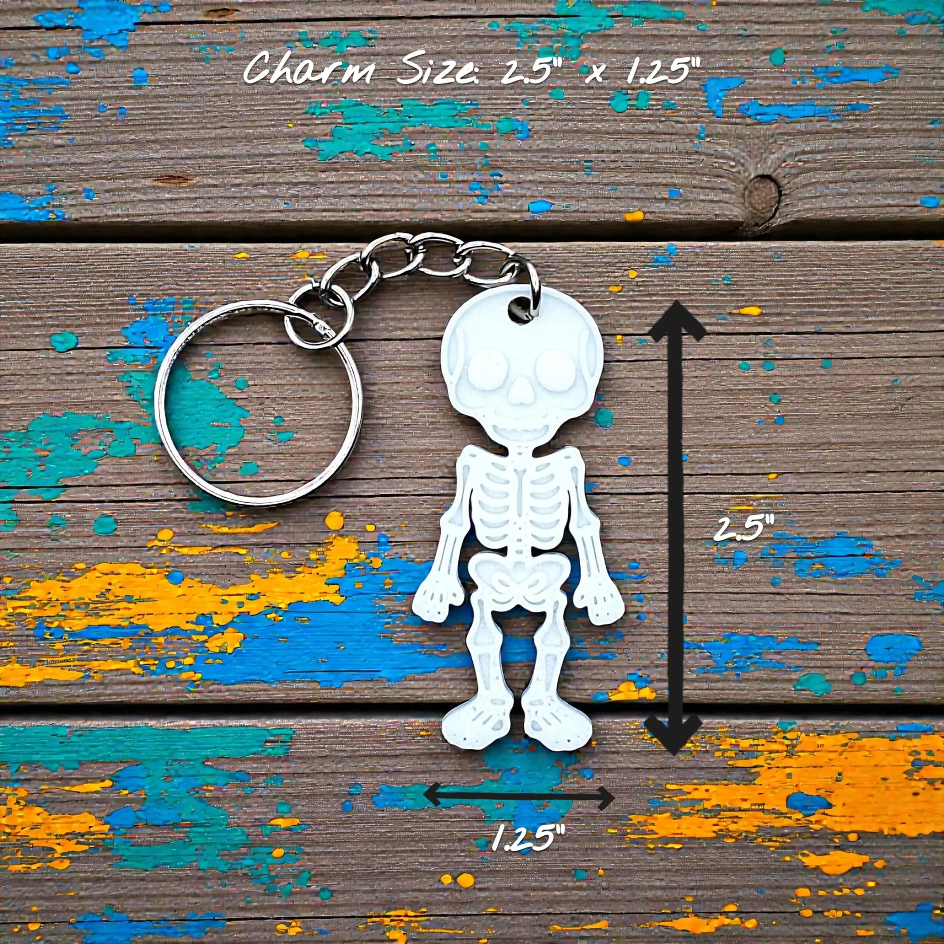 Handmade and customizable skeleton keychain in white, perfect for Halloween party favors, spooky bag charms, and cool classroom prizes.