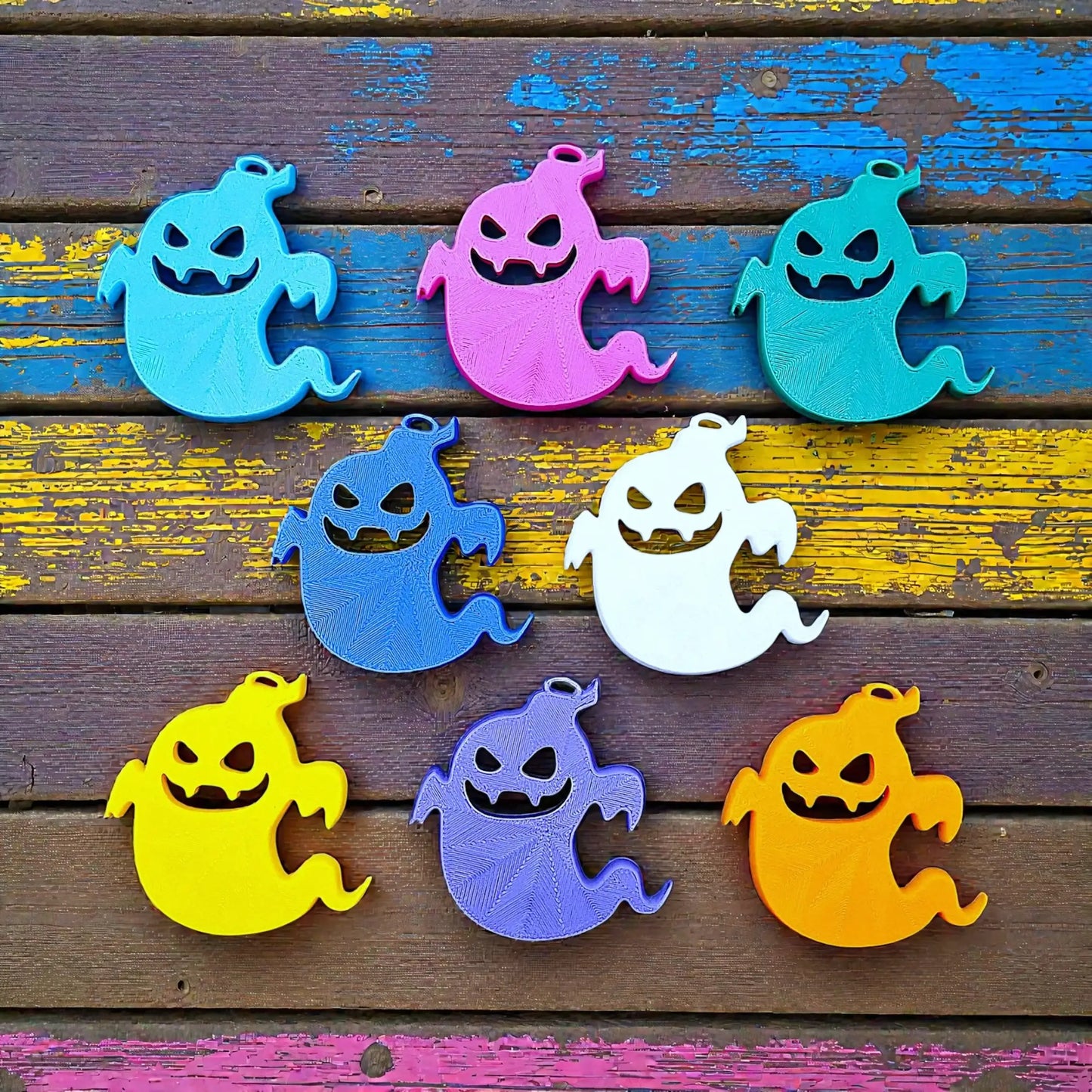 Reverse of handmade and spooky Halloween ghost keychains, ideal for fall party favors, gifting, or accessorizing Halloween-themed trick or treat bags or keys.