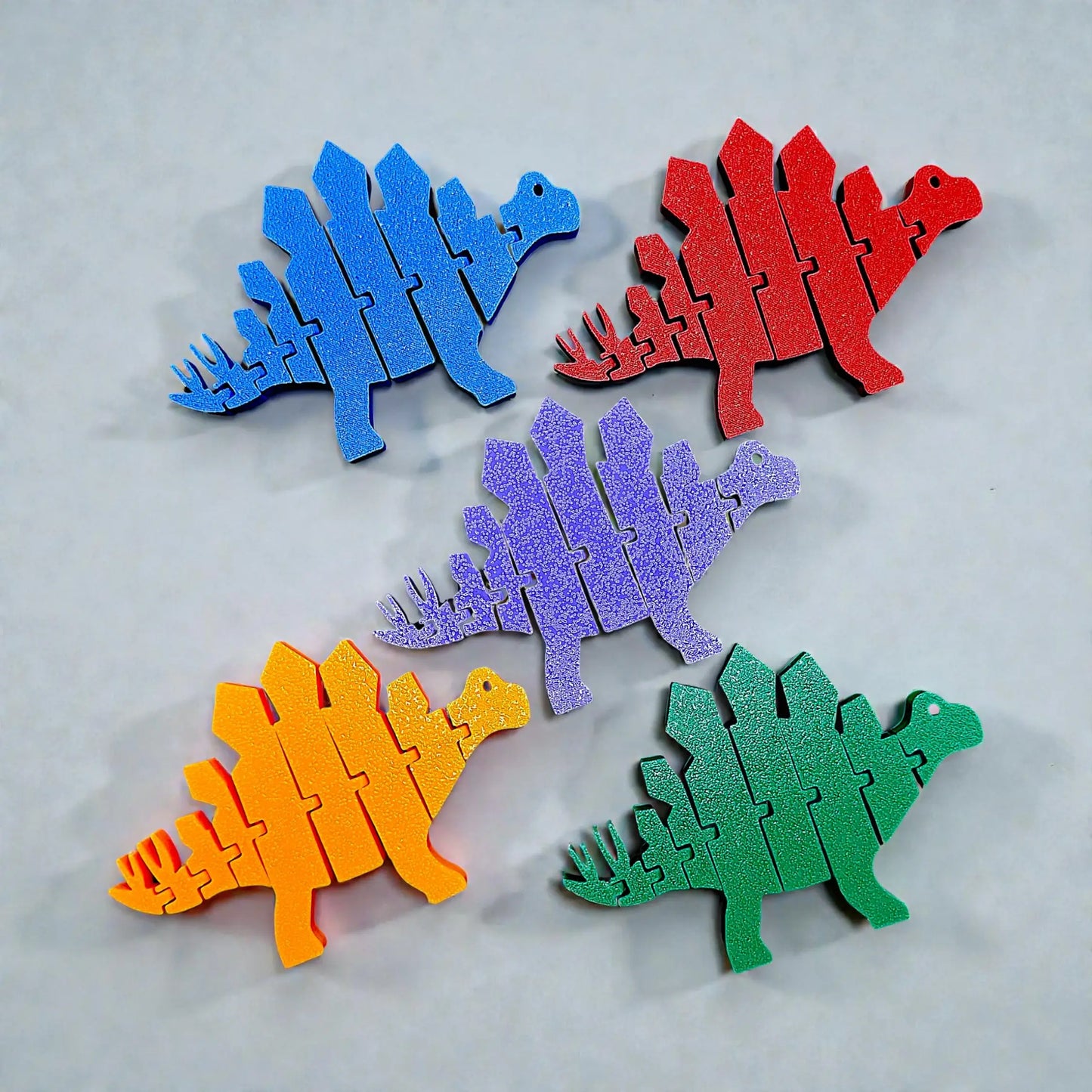 Articulated and customizable stegosaurus dino pretend play fidget toys with movable joints, perfect for dinosaur lovers, sensory play, stress relief, and unique gifts.