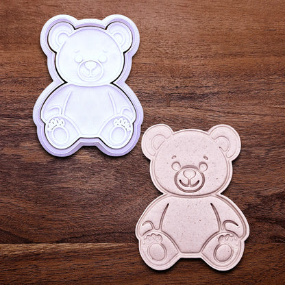 Handmade and customizable teddy bear cookie cutter with stamp featuring a traditional plush bear shape alongside a dough cutout and imprint — perfect for standout cookies at parties or gifting.