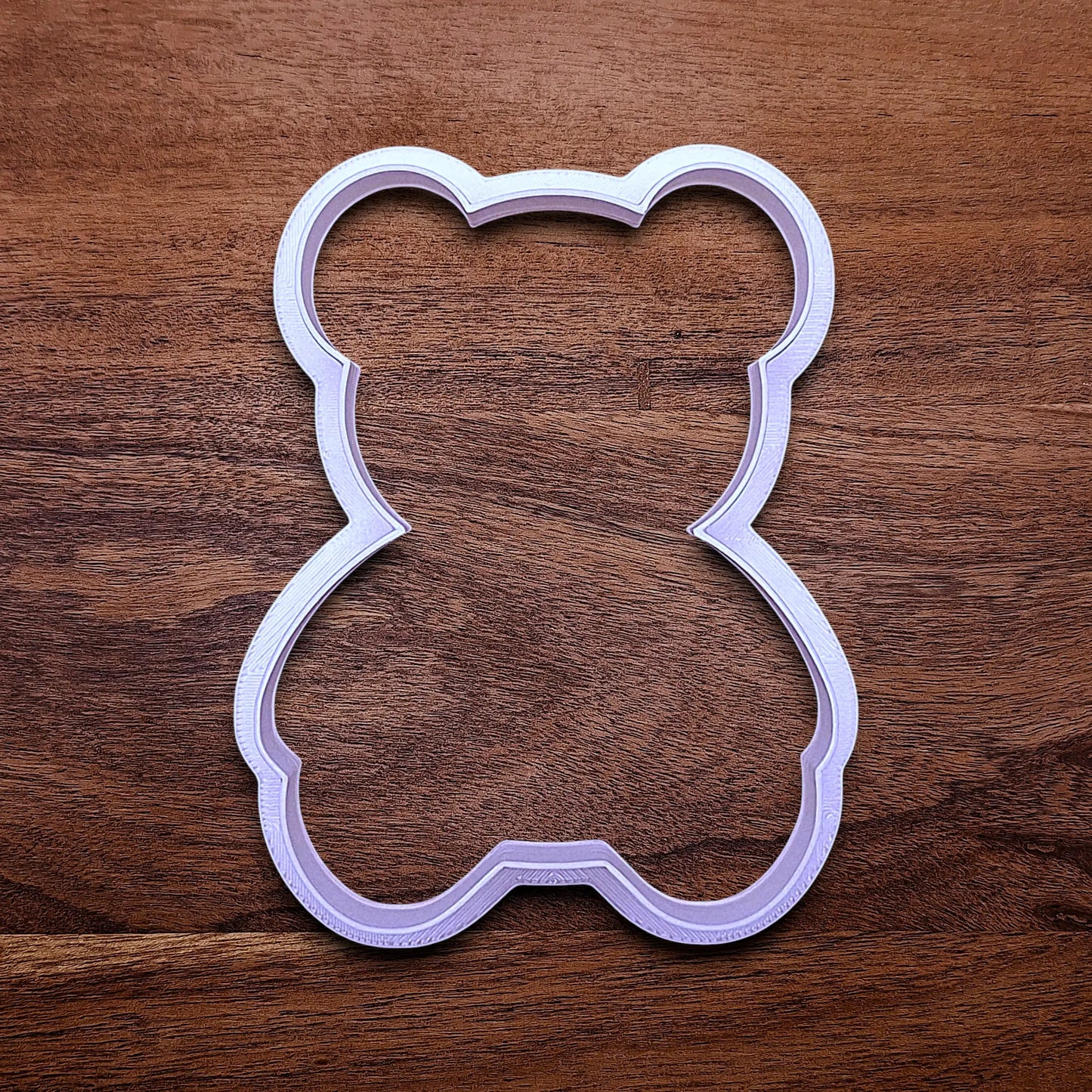 Multiple handmade and customizable teddy bear cookie cutter — perfect for standout cookies at Valentine's Day parties or gifting.