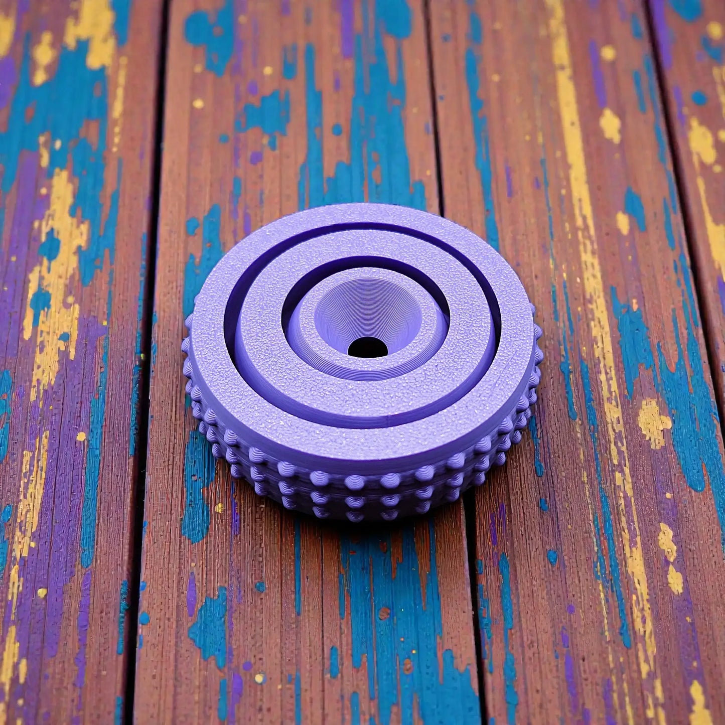 Top-down view of modern fidget spinner model, featuring rounded design and smooth center for easy spinning and stress relief in 3 sizes.
