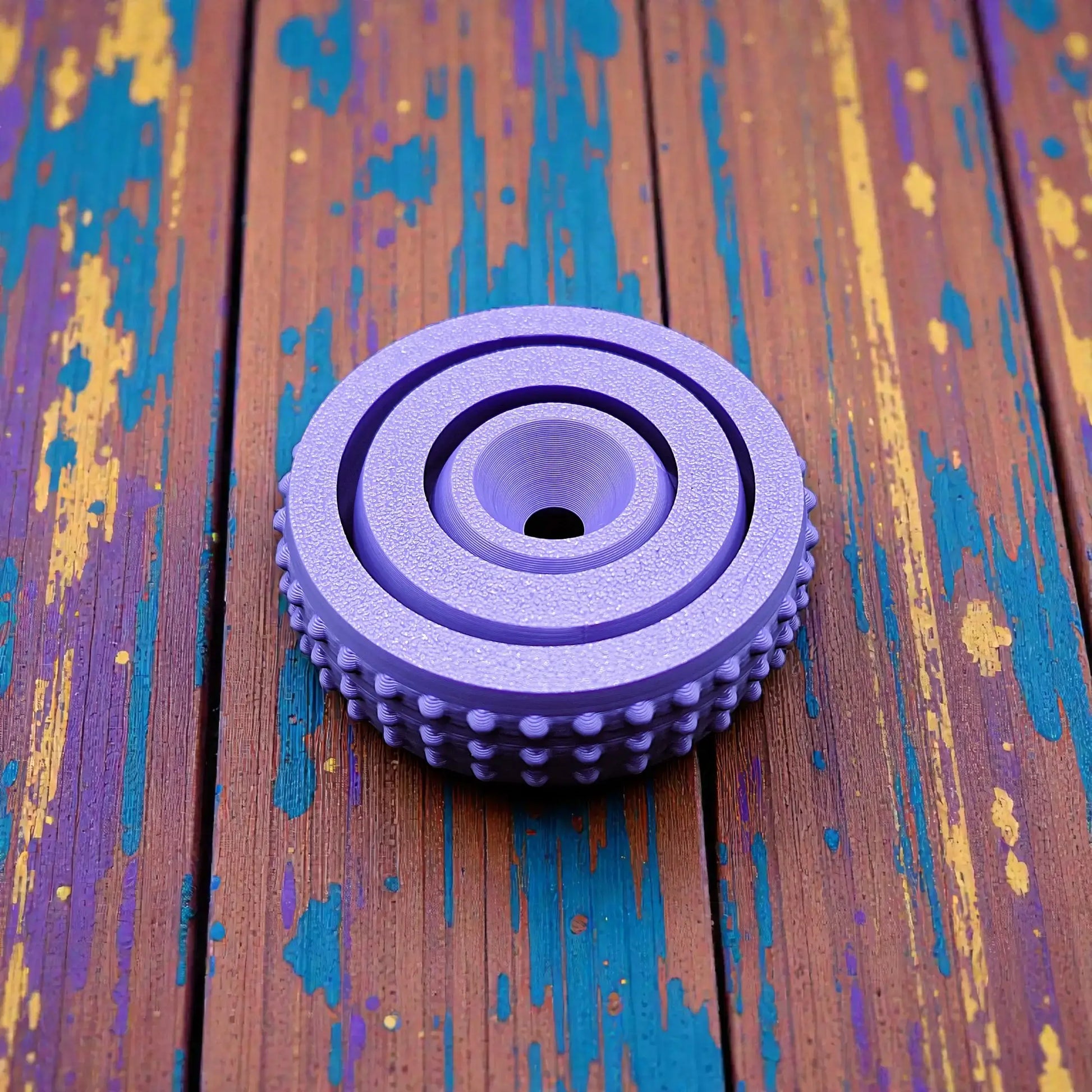 Top-down view of modern fidget spinner model, featuring rounded design and smooth center for easy spinning and stress relief in 3 sizes.