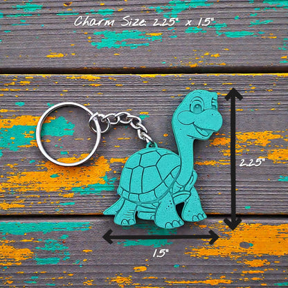 Handmade and customizable turtle keychain in green, ideal for tortoise themed part favors, cute bag charms, and classroom prizes.