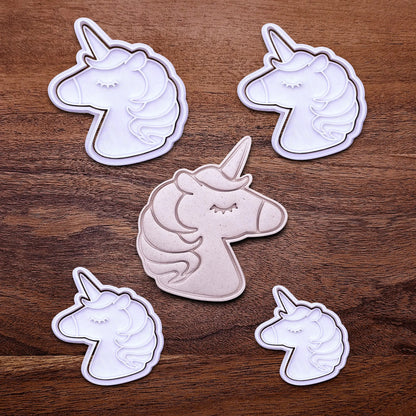 Handmade and customizable unicorn cookie cutters and stamps alongside a dough cutout and imprint, perfect for magical themed birthday parties, fondant decorating, or gifting to unicorn lovers.