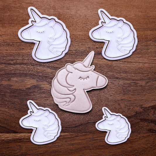 Handmade and customizable unicorn cookie cutters and stamps alongside a dough cutout and imprint, perfect for magical themed birthday parties, fondant decorating, or gifting to unicorn lovers.