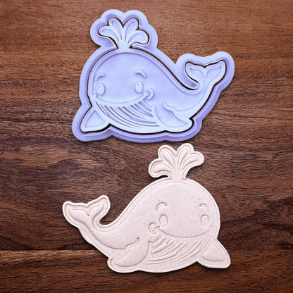 Handmade and customizable whale cookie cutter and stamp set alongside a dough cutout and imprint, ideal for making adorable aquatic and nautical cookies for baby showers, birthdays, and parties.