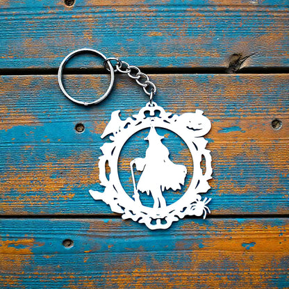 Handmade and customizable Halloween keychain featuring a witch, bats, crows, and pumpkins. Perfect for spooky season trick or treats, party favors and goth inspired gifts.