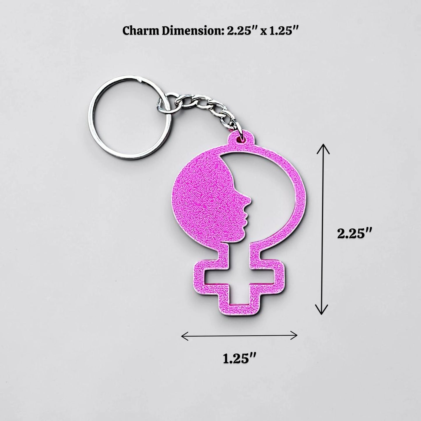 Handmade and customizable women empowerment keychain in magenta, perfect for event giveaways and gifts for feminists.