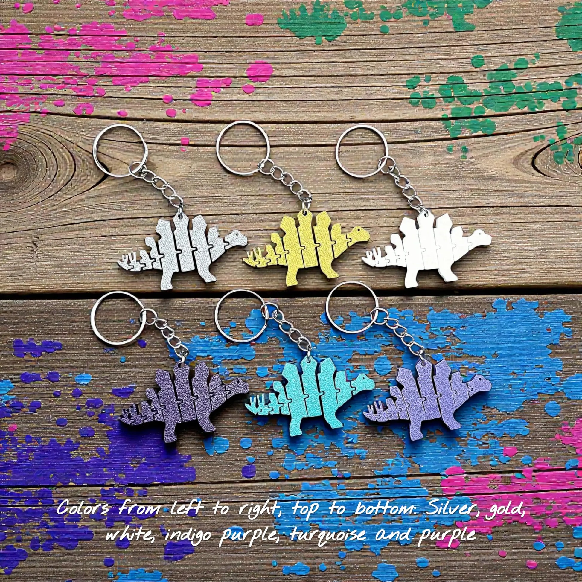 Handmade and customizable dinosaur fidget keychains in assorted colors, featuring colorful articulated designs, perfect for kids birthday parties, classroom prizes, sensory play, and party favor dino gifts.