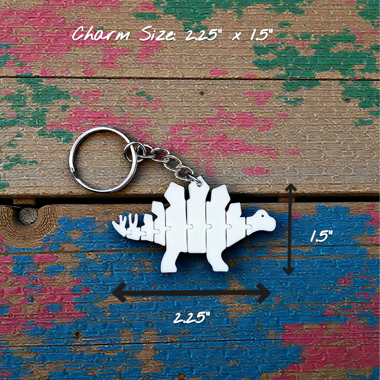 Handmade and customizable dinosaur fidget keychain in white, featuring colorful articulated designs, perfect for kids birthday parties, classroom prizes, sensory play, and party favor dino gifts.