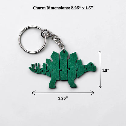 Handmade and customizable dinosaur fidget keychain in white, featuring colorful articulated designs, perfect for kids birthday parties, classroom prizes, sensory play, and party favor dino gifts.