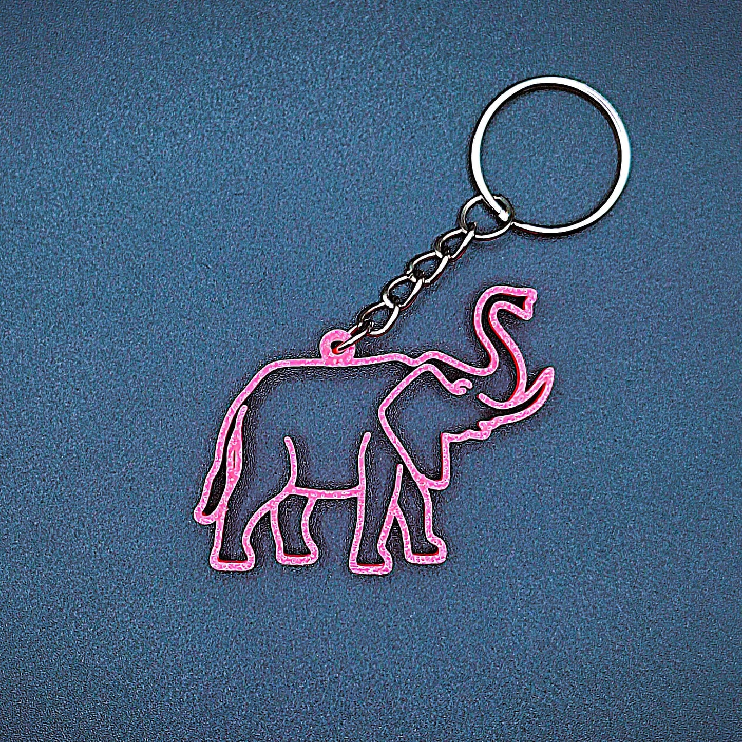 Hot pink elephant keychain shown front-facing with smooth detail, fun handmade charm for elephant lovers, kids, or wildlife party favors.