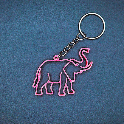 Hot pink elephant keychain shown front-facing with smooth detail, fun handmade charm for elephant lovers, kids, or wildlife party favors.