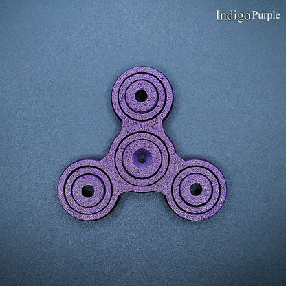 Indigo purple 3" fidget spinner with triple-prong design—perfect sensory tool for stress relief, focus, and calm. Durable, biodegradable, handmade.