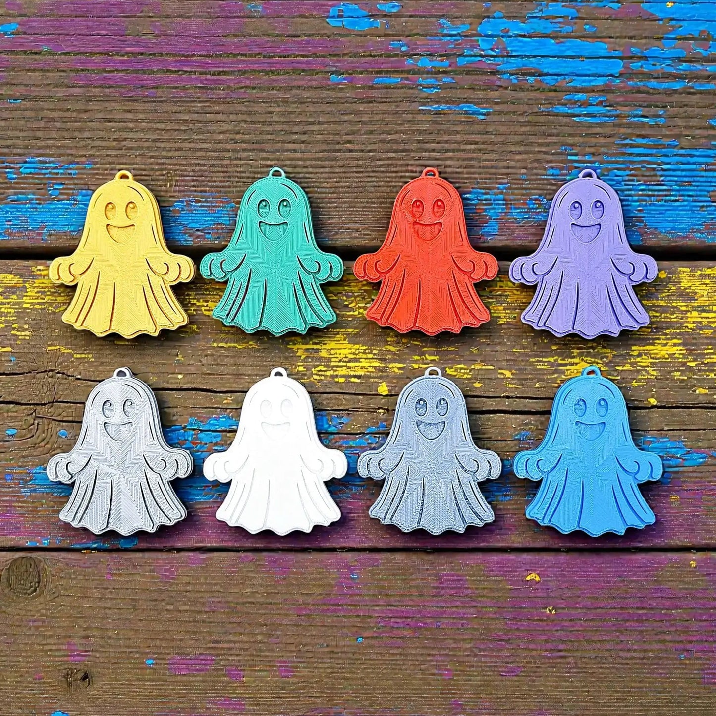 Handmade and customizable ghost keychains in various colors, perfect for Halloween party favors, trick or treats, and fun Fall gifting for kids.