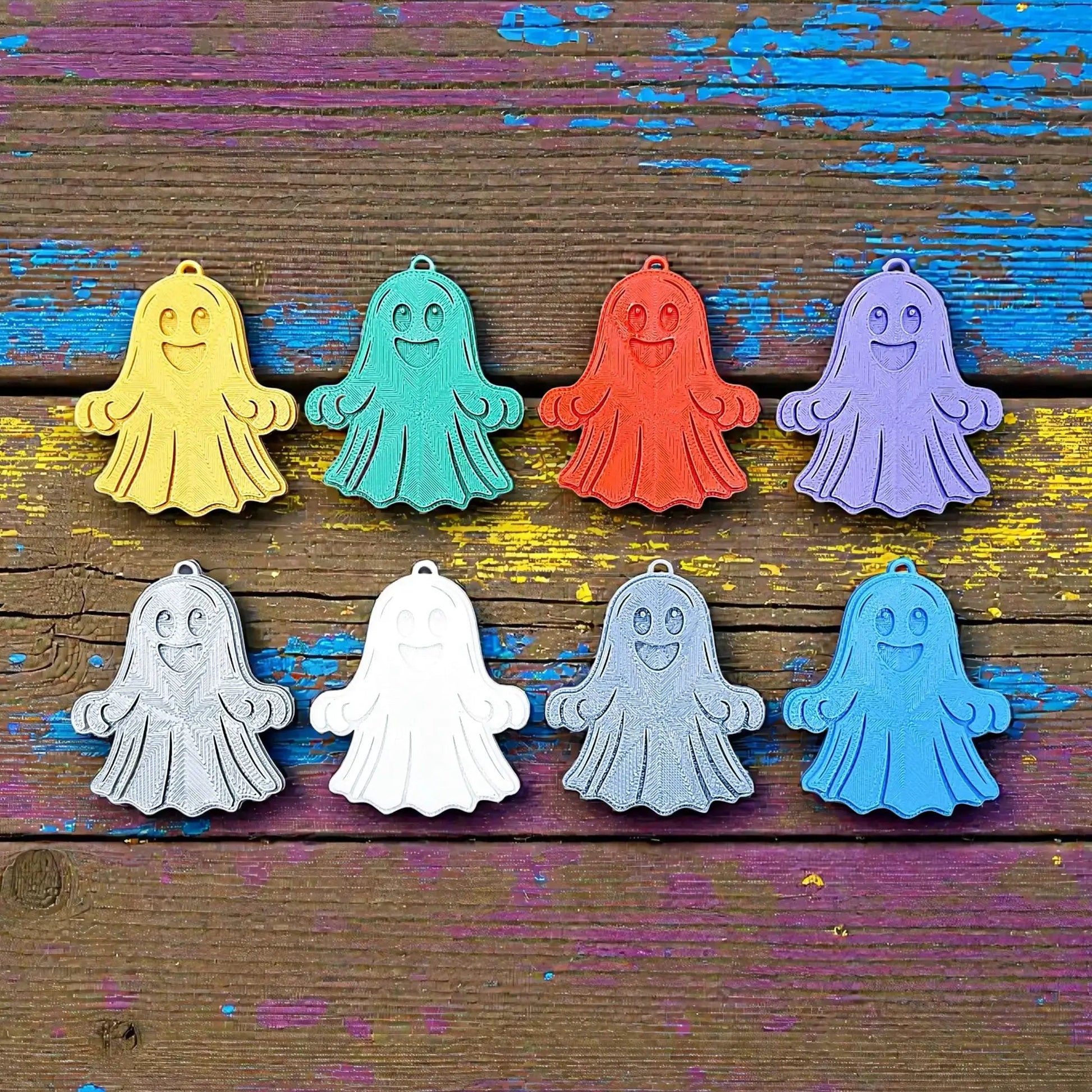 Handmade and customizable ghost keychains in various colors, perfect for Halloween party favors, trick or treats, and fun Fall gifting for kids.