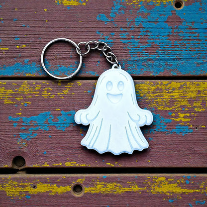 Handmade and customizable ghost keychain in white, perfect for Halloween party favors, trick or treats, and fun Fall gifting for kids.