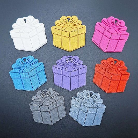 Top view of 8-pack gift box keychains in assorted colors—fun, eco-conscious present charms perfect for gifting, crafting, or party decorations.
