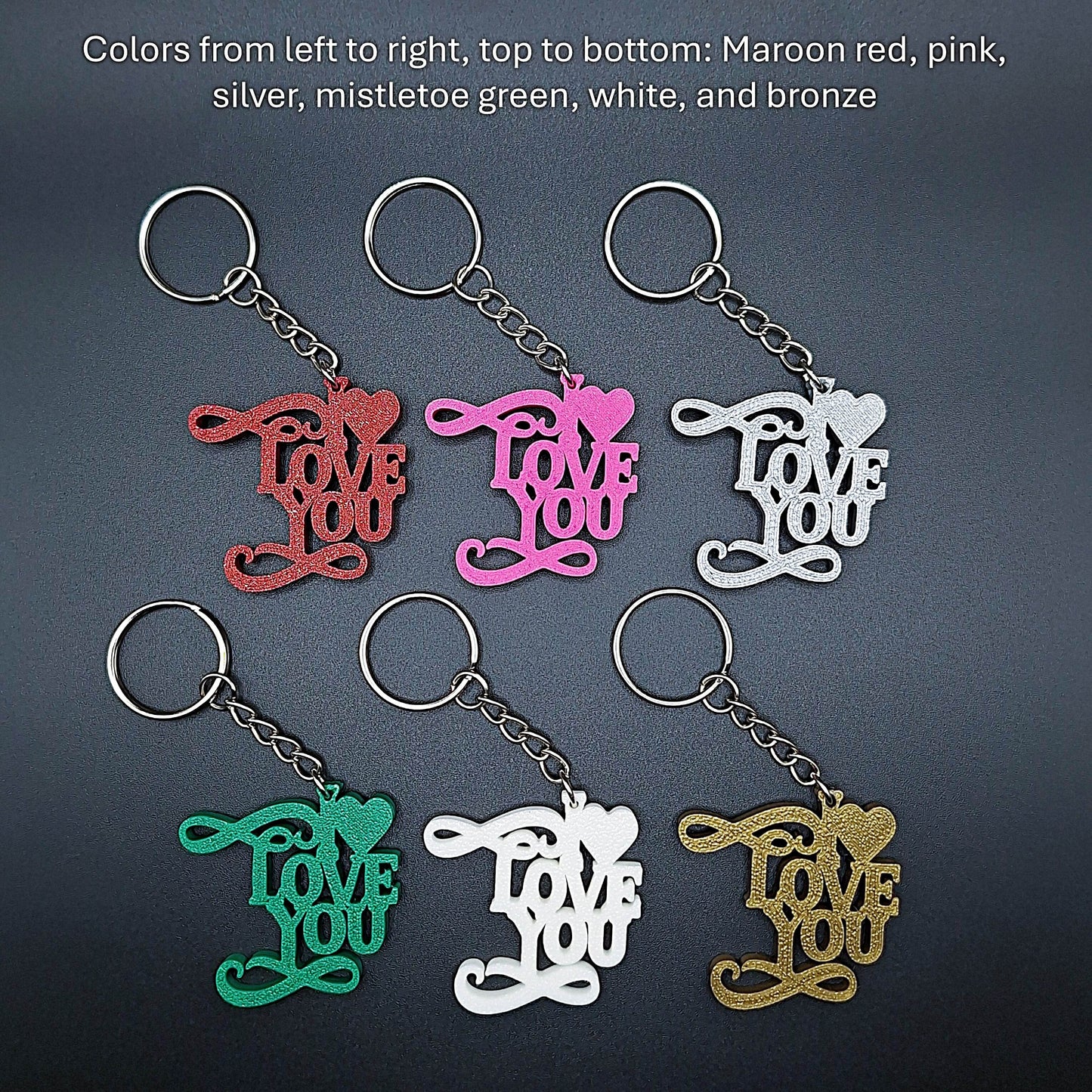Close-up of six “I ❤️ You” keychains in various shades, eco-friendly plastic charms ideal for gifting love and appreciation all year round.
